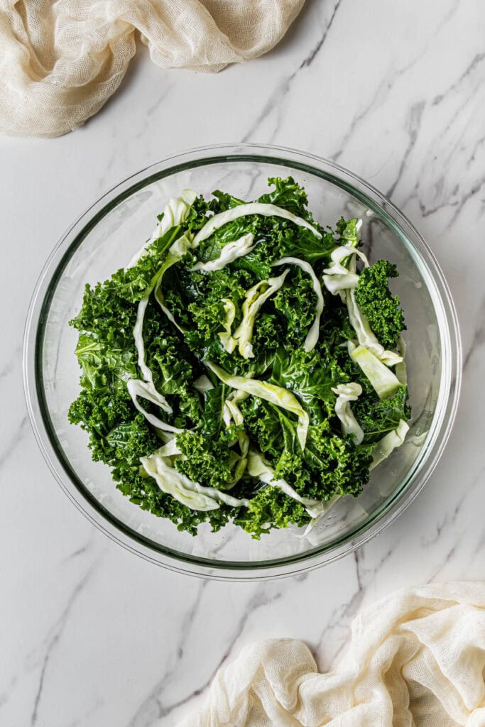 A glass bowl with crunchy greens in it.