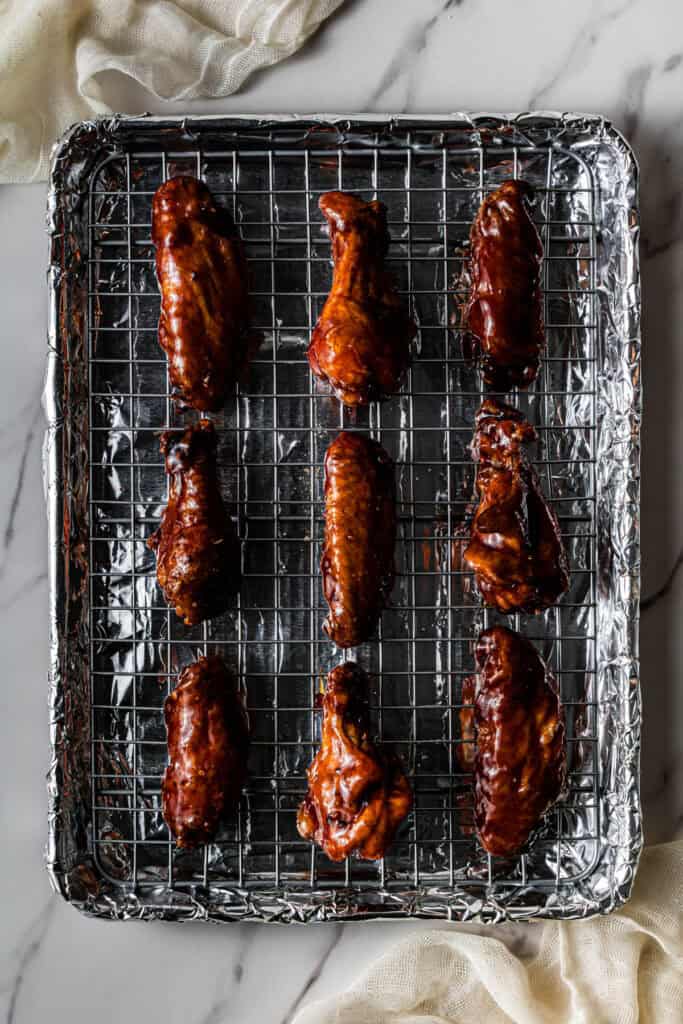 meat on a wire rack on a baking sheet