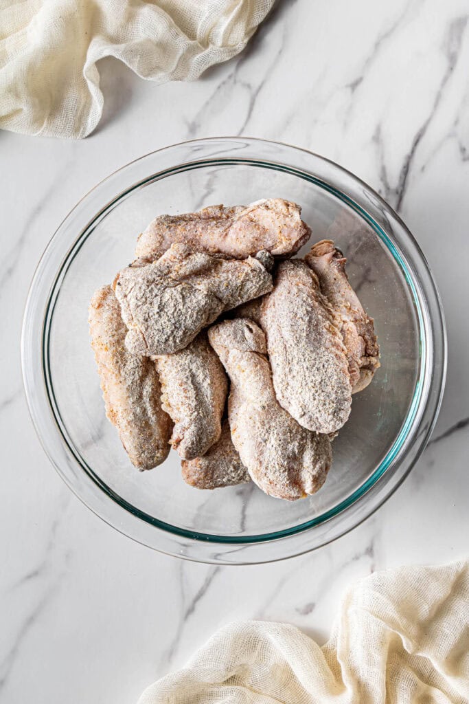 seasoned dry batter and meat in a bowl