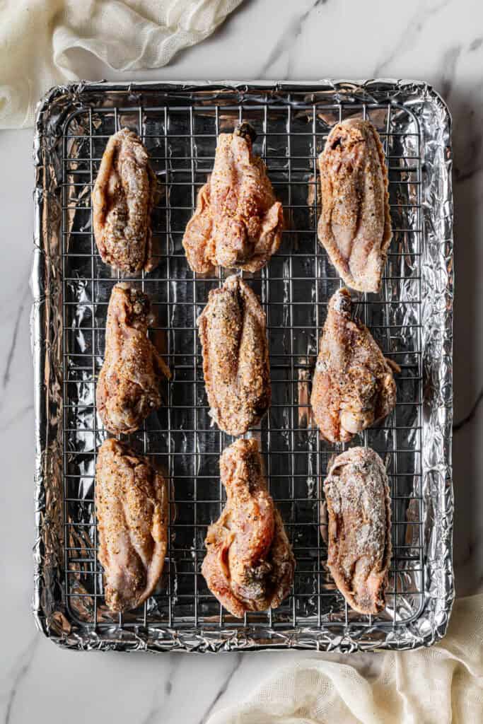 meat on a rack on a baking pan