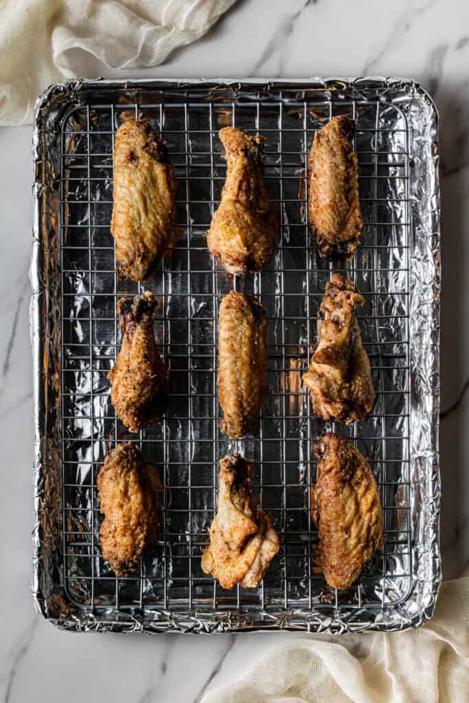meat on a rack on a baking pan