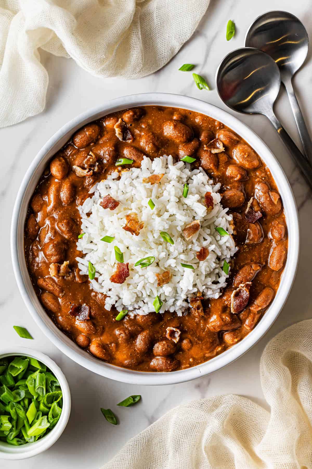 Flat lay shot of a shallow bowl with Copycat Popeye's Red Beans and Rice.