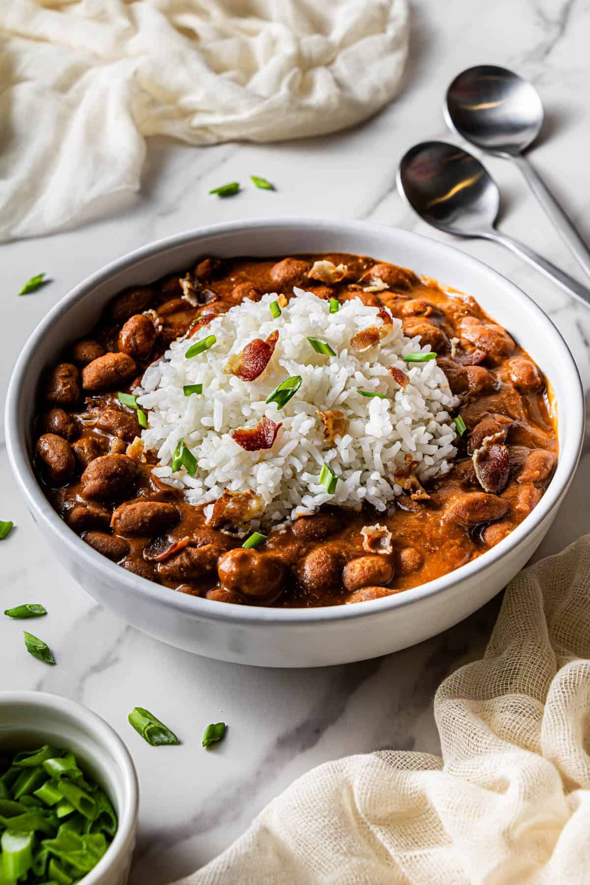 A serving of the finished Copycat Red Beans and Rice in a white bowl.