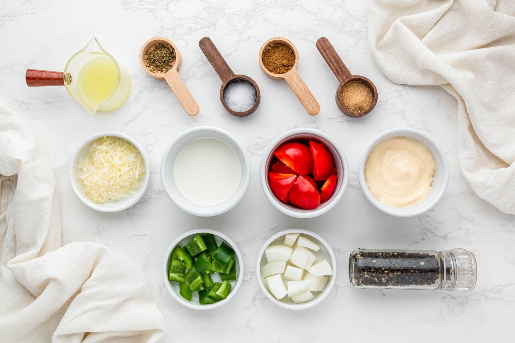 Ingredients for creamy spicy taco sauce arranged on counter