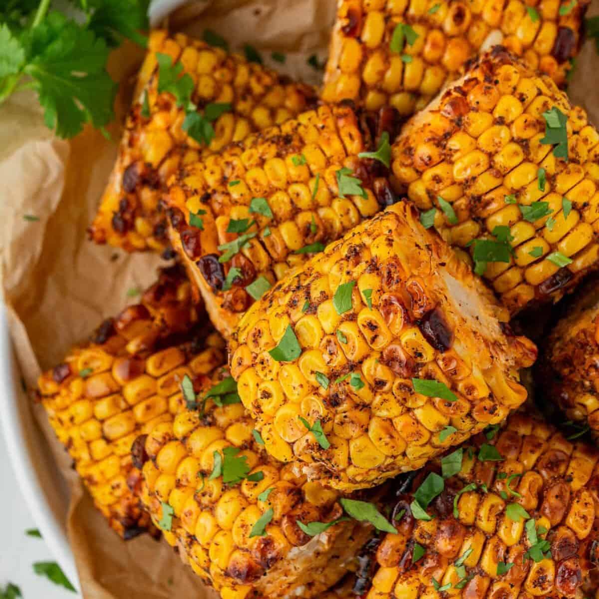 Close-up of charred spicy Wingstop Cajun Corn Recipe on the cob