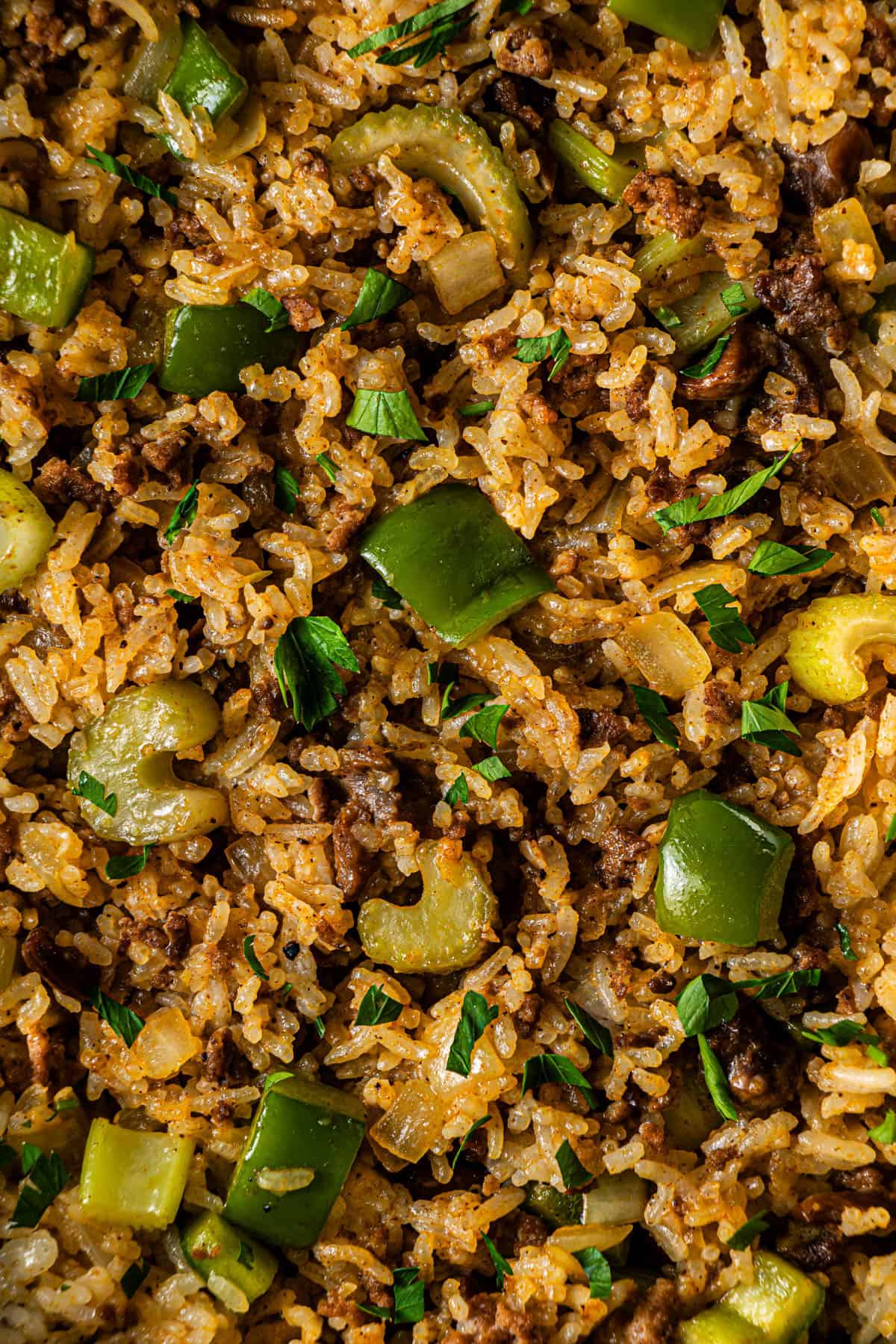 Close-up of Popeye’s Cajun Rice showing seasoned rice, beef, and vegetables