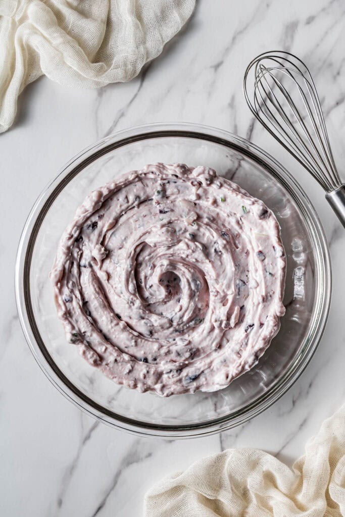 creamy cranberry jalapeño dip mixture fully combined in mixing bowl