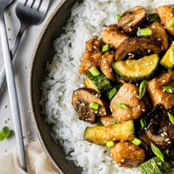 Panda Express mushroom chicken served over white rice in a bowl