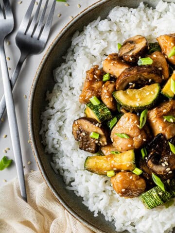 Panda Express mushroom chicken served over white rice in a bowl