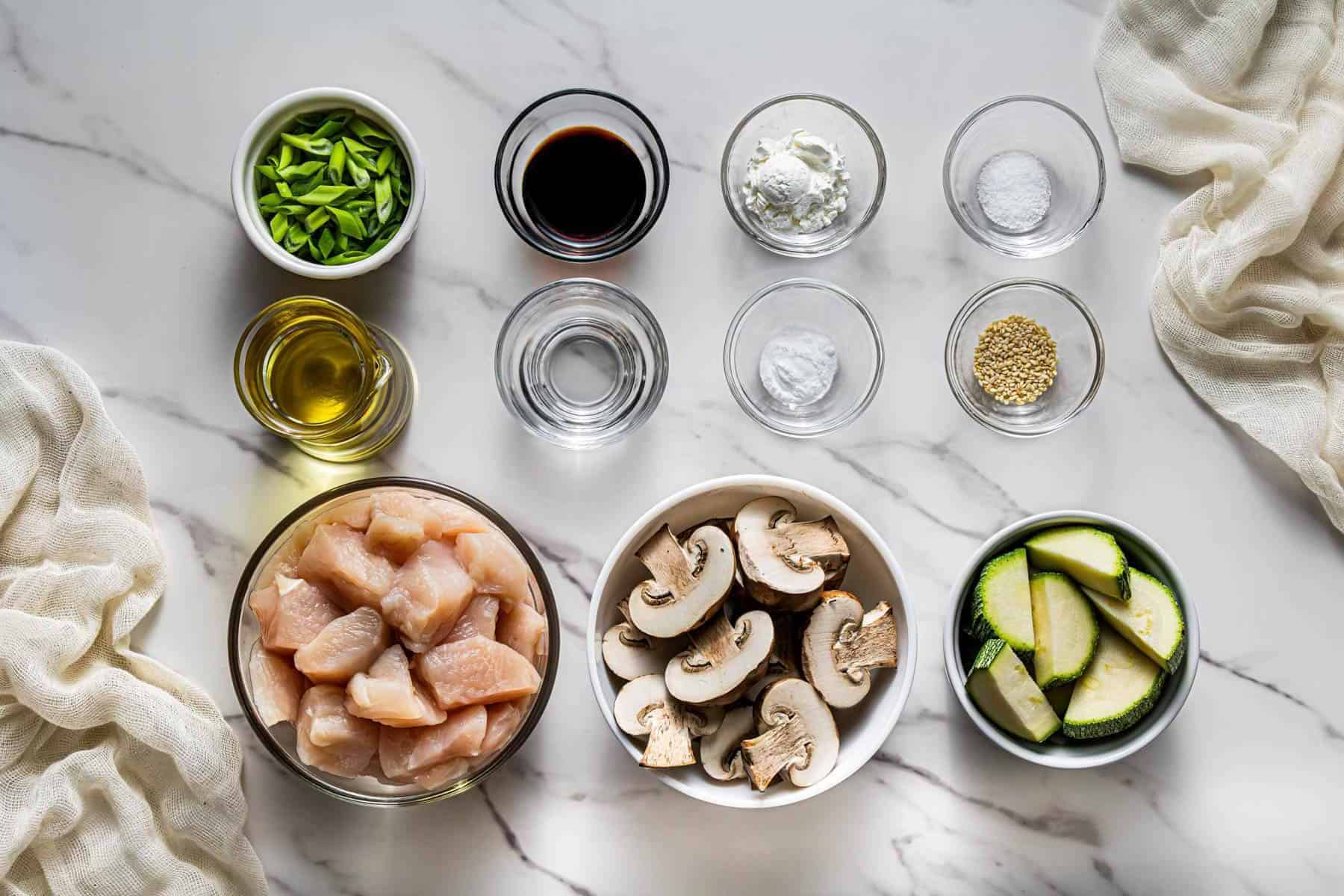 Ingredients for Panda Express mushroom chicken including chicken, mushrooms, zucchini, soy sauce, and seasonings
