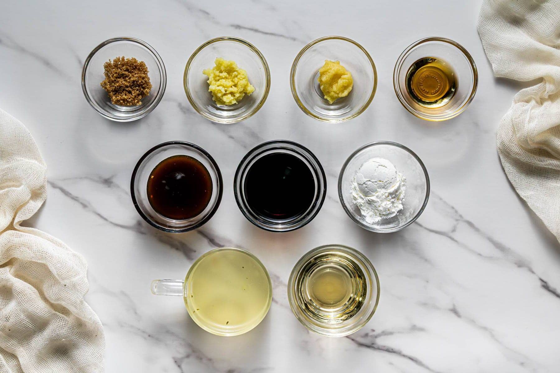 Sauce ingredients for mushroom chicken including soy sauce, oyster sauce, garlic, ginger, and cornstarch