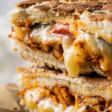 Copycat Panera Frontega Chicken Sandwich stacked with seasoned chicken, melted mozzarella, tomatoes, and toasted focaccia