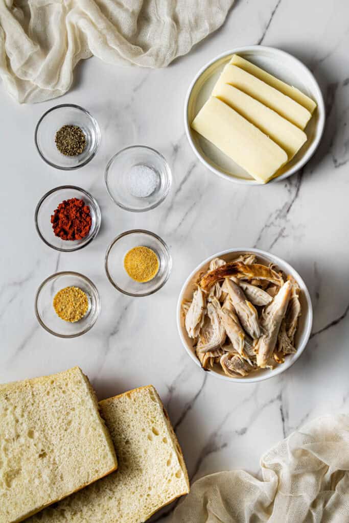 Ingredients for making a copycat Panera Frontega Chicken Sandwich including rotisserie chicken and spices