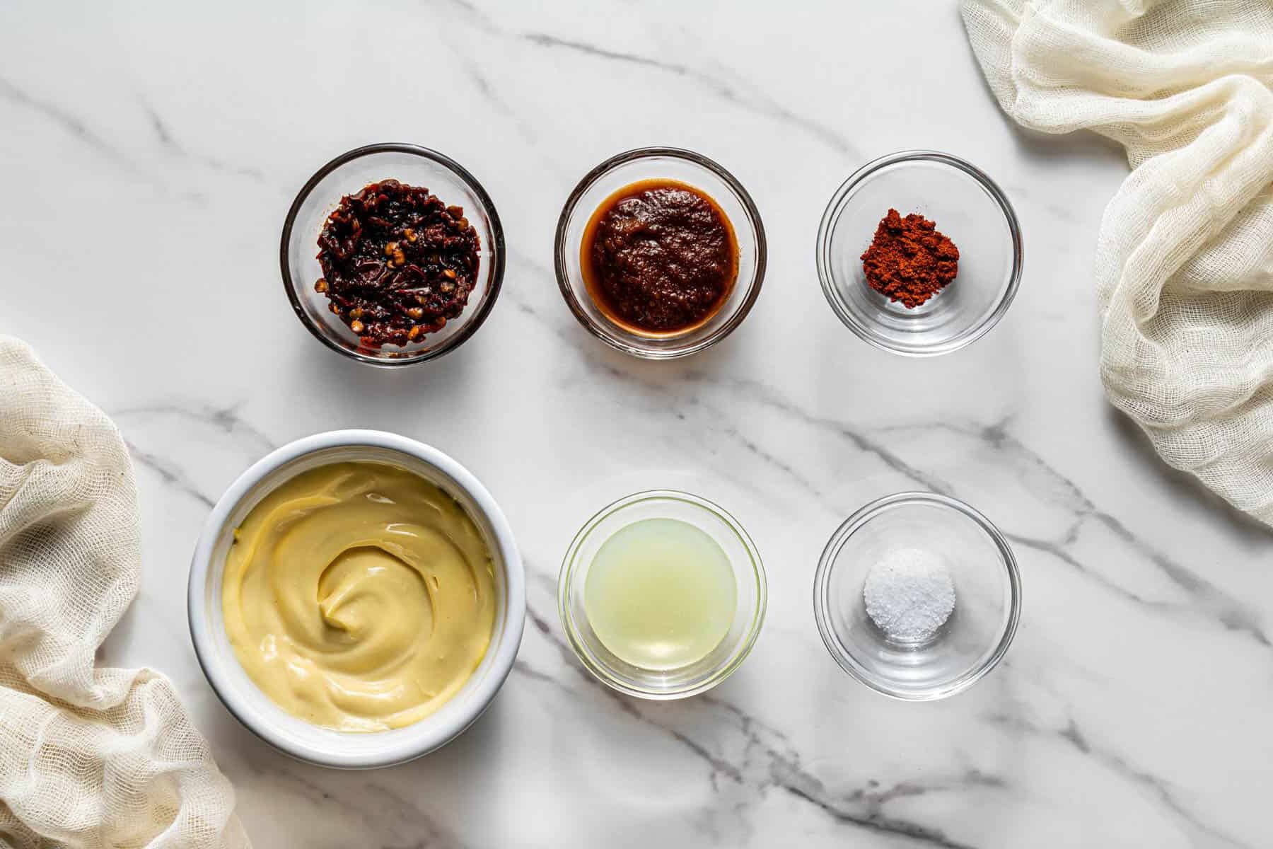 Chipotle mayo ingredients including mayonnaise, adobo sauce, lime juice, and spices