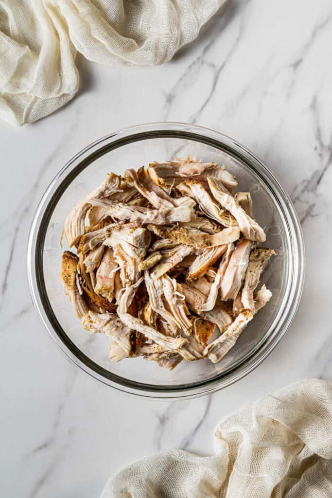 Shredded rotisserie chicken prepared for sandwich filling